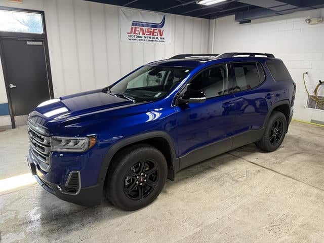 2023 GMC Acadia AT4 in Ultra Blue Metallic — front three-quarter view