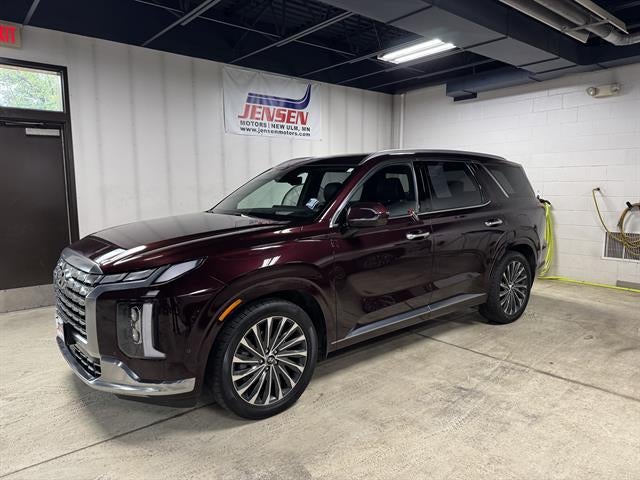 2023 Hyundai Palisade Calligraphy in Sierra Burgundy — front three-quarter view